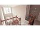 Open staircase with wood and iron railing showcases views from the main level at 779 Avonley Creek Trce, Sugar Hill, GA 30518