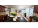 Open concept kitchen with granite counters and breakfast area offers sightlines to the living space at 779 Avonley Creek Trce, Sugar Hill, GA 30518