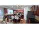 Well-equipped kitchen featuring an island, stainless steel appliances, and dark wood cabinetry with natural light at 779 Avonley Creek Trce, Sugar Hill, GA 30518