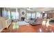 Inviting living room featuring a fireplace, hardwood floors, plenty of natural light, and modern decor at 779 Avonley Creek Trce, Sugar Hill, GA 30518