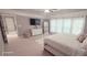 Spacious main bedroom with carpet floors, large windows, and a ceiling fan at 779 Avonley Creek Trce, Sugar Hill, GA 30518