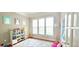 Bright play room with organized toy storage, a cozy rug, and ample natural light for creative fun at 779 Avonley Creek Trce, Sugar Hill, GA 30518
