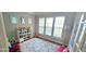 Cozy playroom with natural light, featuring books, toys, and a colorful rug at 779 Avonley Creek Trce, Sugar Hill, GA 30518