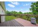 Exterior of a home showcasing a wooden deck with a grill, and a green outdoor view at 11072 Pebble Ridge Dr, Hampton, GA 30228