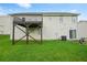 Exterior of a home showcasing a backyard and deck, on a grassy lot at 11072 Pebble Ridge Dr, Hampton, GA 30228