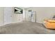 Bedroom with mounted TV, soft carpet and a full length mirror, offers entertainment and functionality at 11072 Pebble Ridge Dr, Hampton, GA 30228