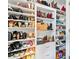 Walk-in closet is fully organized with custom shelving for shoes, boots, and accessories at 11072 Pebble Ridge Dr, Hampton, GA 30228
