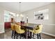 Dining room with stylish table and seating, with sight lines to the living area at 11072 Pebble Ridge Dr, Hampton, GA 30228