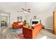 Cozy living room features vaulted ceiling, fireplace, laminate flooring, and stylish furniture, creating a welcoming atmosphere at 11072 Pebble Ridge Dr, Hampton, GA 30228