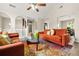 Spacious living room showcasing an open floor plan, modern furniture, and laminate floors, offering a stylish and inviting space at 11072 Pebble Ridge Dr, Hampton, GA 30228