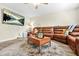 Spacious living room features comfortable seating, natural light, and hardwood floors at 11072 Pebble Ridge Dr, Hampton, GA 30228