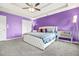 Spacious main bedroom with a ceiling fan, carpet, and side tables at 11072 Pebble Ridge Dr, Hampton, GA 30228