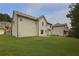 Backyard featuring green grass and an exterior view of the back of the house at 1433 Sand Way, Lawrenceville, GA 30045