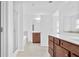 A modern bathroom with tile flooring, a glass shower, and wood cabinets with a light countertop at 1433 Sand Way, Lawrenceville, GA 30045
