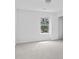 Empty bedroom with carpet and a window at 1433 Sand Way, Lawrenceville, GA 30045