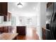 Kitchen with wood cabinets, granite countertops, and stainless-steel refrigerator at 1433 Sand Way, Lawrenceville, GA 30045