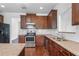 Kitchen with stainless-steel appliances and granite countertops at 1433 Sand Way, Lawrenceville, GA 30045