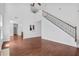 Spacious living room with hardwood floors and staircase at 1433 Sand Way, Lawrenceville, GA 30045
