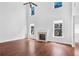 Spacious living room with wood floors, fireplace, tall ceilings and large windows at 1433 Sand Way, Lawrenceville, GA 30045