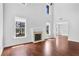 Bright living room with a fireplace and gleaming hardwood floors at 1433 Sand Way, Lawrenceville, GA 30045