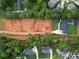 Aerial view of a new home construction site, neighboring a completed home with a large backyard at 2709 Collins Hill Rd, Lawrenceville, GA 30043