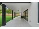 This covered patio has dark beams and an outdoor kitchen at 2709 Collins Hill Rd, Lawrenceville, GA 30043