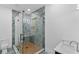 This bathroom boasts a frameless glass shower with tiled walls and niche, paired with modern vanity and fixtures at 2709 Collins Hill Rd, Lawrenceville, GA 30043