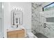 Modern bathroom with a glass-enclosed shower and marble countertop at 2709 Collins Hill Rd, Lawrenceville, GA 30043