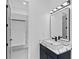 Chic bathroom featuring a modern vanity and walk-in closet for added convenience at 2709 Collins Hill Rd, Lawrenceville, GA 30043