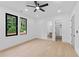 Spacious bedroom features hardwood floors, recessed lights, ceiling fan, and ensuite bathroom at 2709 Collins Hill Rd, Lawrenceville, GA 30043