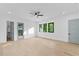 Bright bedroom with a ceiling fan, hardwood floors, and a walk-in closet at 2709 Collins Hill Rd, Lawrenceville, GA 30043