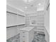 Spacious walk-in closet with custom shelving, drawers, and a central island for storage at 2709 Collins Hill Rd, Lawrenceville, GA 30043