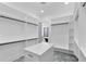 Walk-in closet with custom shelves and drawers and access to the bathroom at 2709 Collins Hill Rd, Lawrenceville, GA 30043