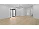 Bright dining room with modern chandelier, hardwood floors, and modern black doors at 2709 Collins Hill Rd, Lawrenceville, GA 30043