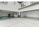 Spacious garage with modern epoxy flooring and high ceilings, equipped with built-in storage and ample lighting at 2709 Collins Hill Rd, Lawrenceville, GA 30043