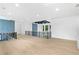 Open hallway with modern design elements, hardwood floors, and decorative blue paneling at 2709 Collins Hill Rd, Lawrenceville, GA 30043