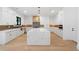 Elegant kitchen with white cabinetry, large island, stainless appliances, and stylish backsplash at 2709 Collins Hill Rd, Lawrenceville, GA 30043