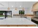 The kitchen showcases a large island, modern lighting, and stainless steel appliances at 2709 Collins Hill Rd, Lawrenceville, GA 30043