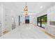 A bright, spacious kitchen includes an island with marble countertop and stainless steel appliances at 2709 Collins Hill Rd, Lawrenceville, GA 30043