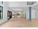 Open floor plan features a modern kitchen and living space with hardwood floors and great natural light at 2709 Collins Hill Rd, Lawrenceville, GA 30043