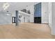 Large open living area with modern lighting, fireplace, and expansive windows filling the space at 2709 Collins Hill Rd, Lawrenceville, GA 30043