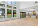 Bright open concept showcasing the living area with floor to ceiling windows and connected kitchen at 2709 Collins Hill Rd, Lawrenceville, GA 30043