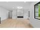 A spacious living room features modern fireplace and expansive windows for natural light at 2709 Collins Hill Rd, Lawrenceville, GA 30043