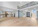 Spacious open floor plan with modern kitchen, light wood floors, and stylish accents at 2709 Collins Hill Rd, Lawrenceville, GA 30043