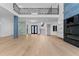 Spacious living room featuring tall ceilings, hardwood floors, a modern fireplace, and a stylish second-story balcony at 2709 Collins Hill Rd, Lawrenceville, GA 30043
