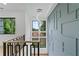 A stylish staircase with unique wall paneling and natural light from large windows at 2709 Collins Hill Rd, Lawrenceville, GA 30043