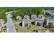 Aerial view of the property shows a well-maintained neighborhood, with lush greenery and manicured lawns at 3259 Ivy Crossing Dr, Buford, GA 30519