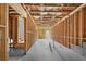 Unfinished basement awaiting personalization with wooden framing and visible ceiling insulation at 3259 Ivy Crossing Dr, Buford, GA 30519