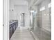 Bathroom featuring a glass shower, granite countertops with double sink vanity, and tiled floors at 3259 Ivy Crossing Dr, Buford, GA 30519