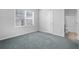 Bedroom featuring natural light, carpet flooring and an adjacent bathroom at 3259 Ivy Crossing Dr, Buford, GA 30519